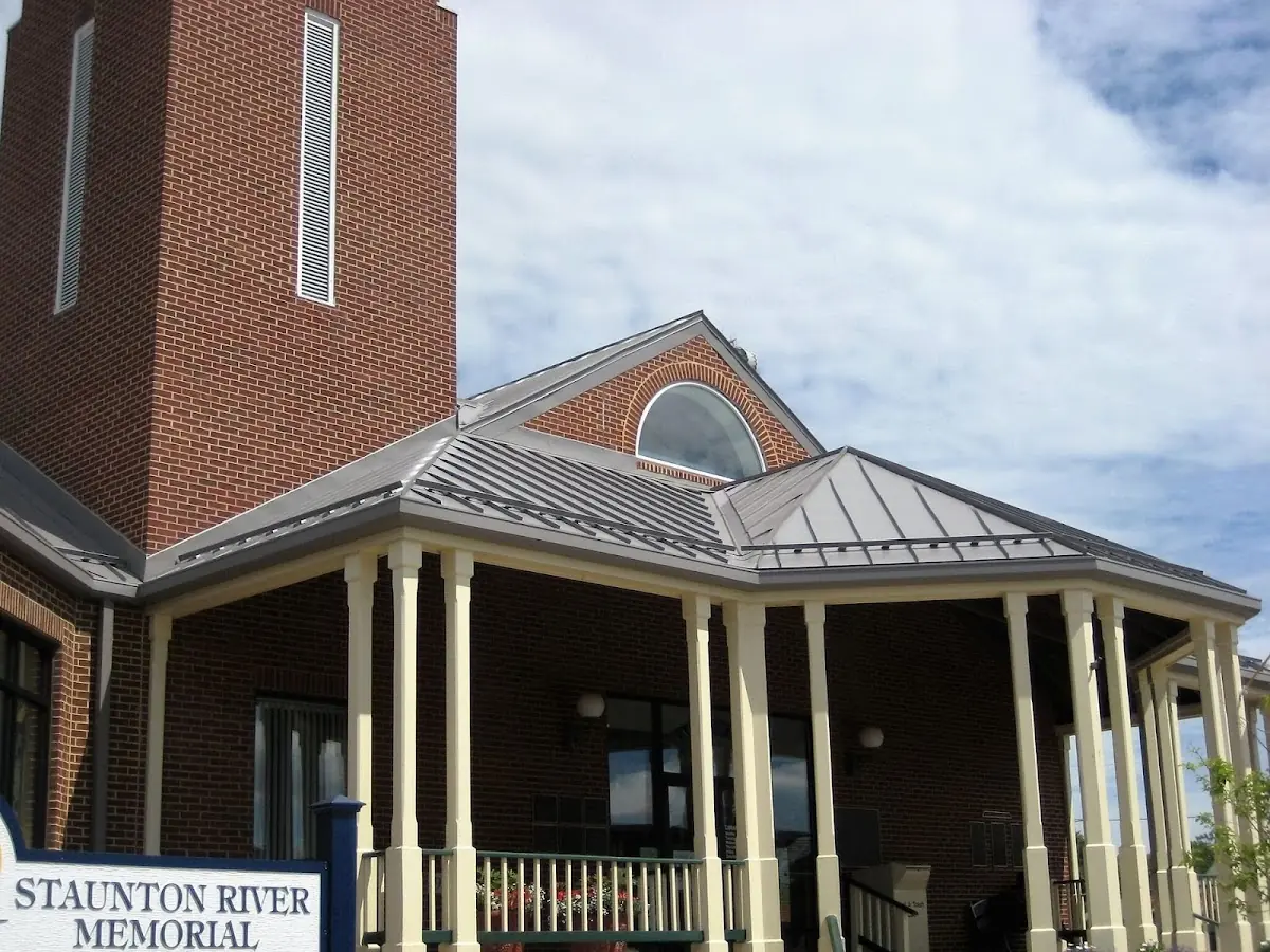 Skilled roofing craftsmen working on a residential roof in Brownville